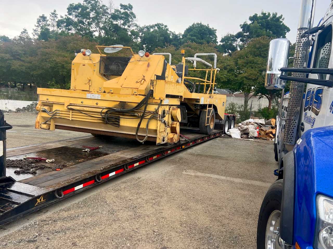 image of loading a used chip spreader for shipping